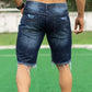 Short en jean bleu foncé déchiré